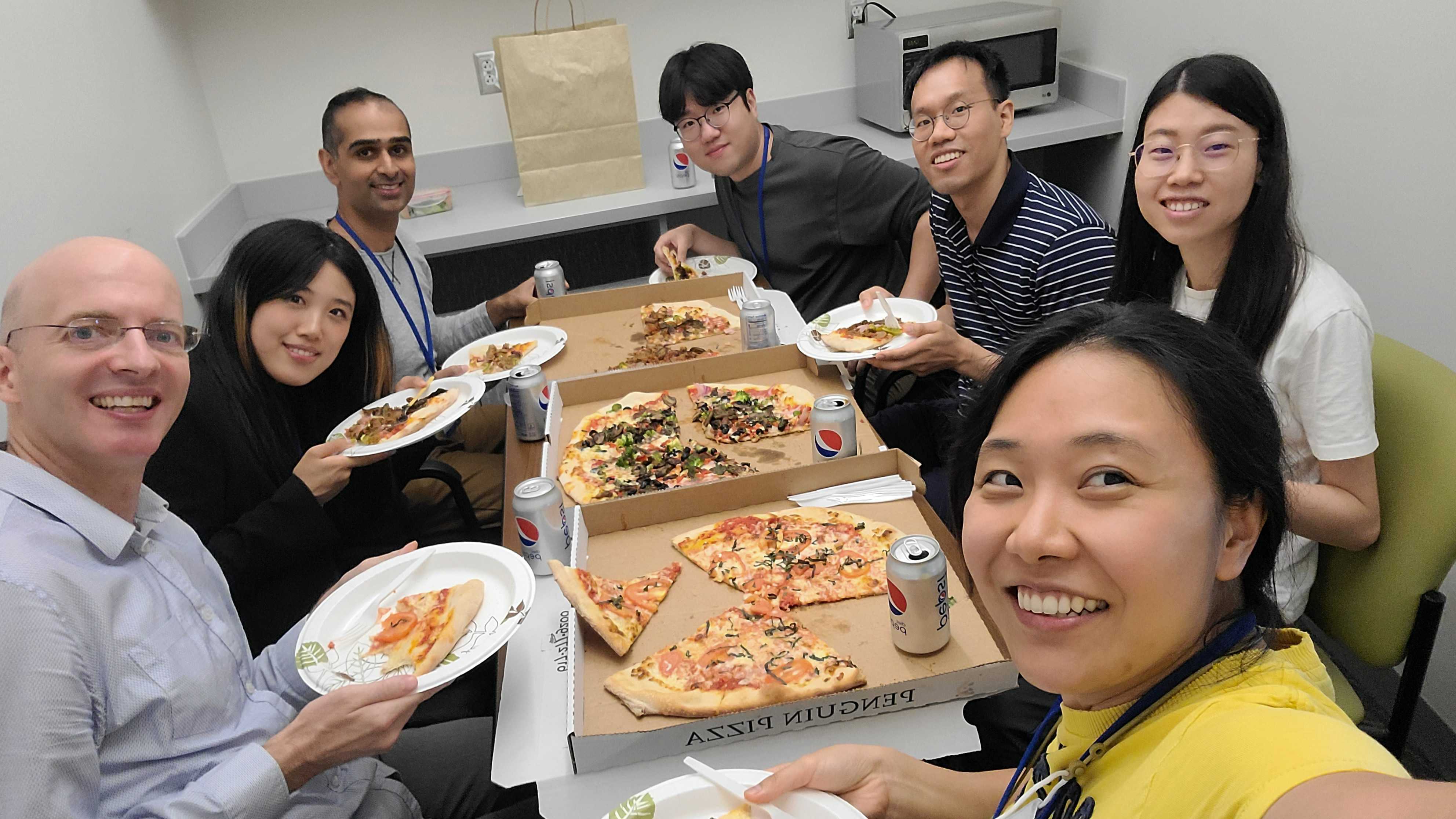 Lab eating pizza